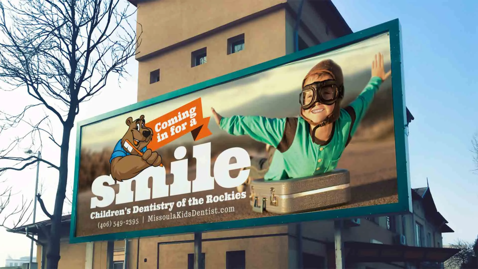 Pediatric Dentist billboard of kid dressed like an airplane pilot