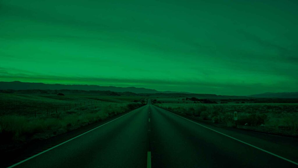 straight highway road vanishing into the mountains in the distance cover image
